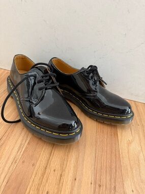 Dr. Marten’s Patent Black Lace-Up Flats with Yellow Stitch Detail